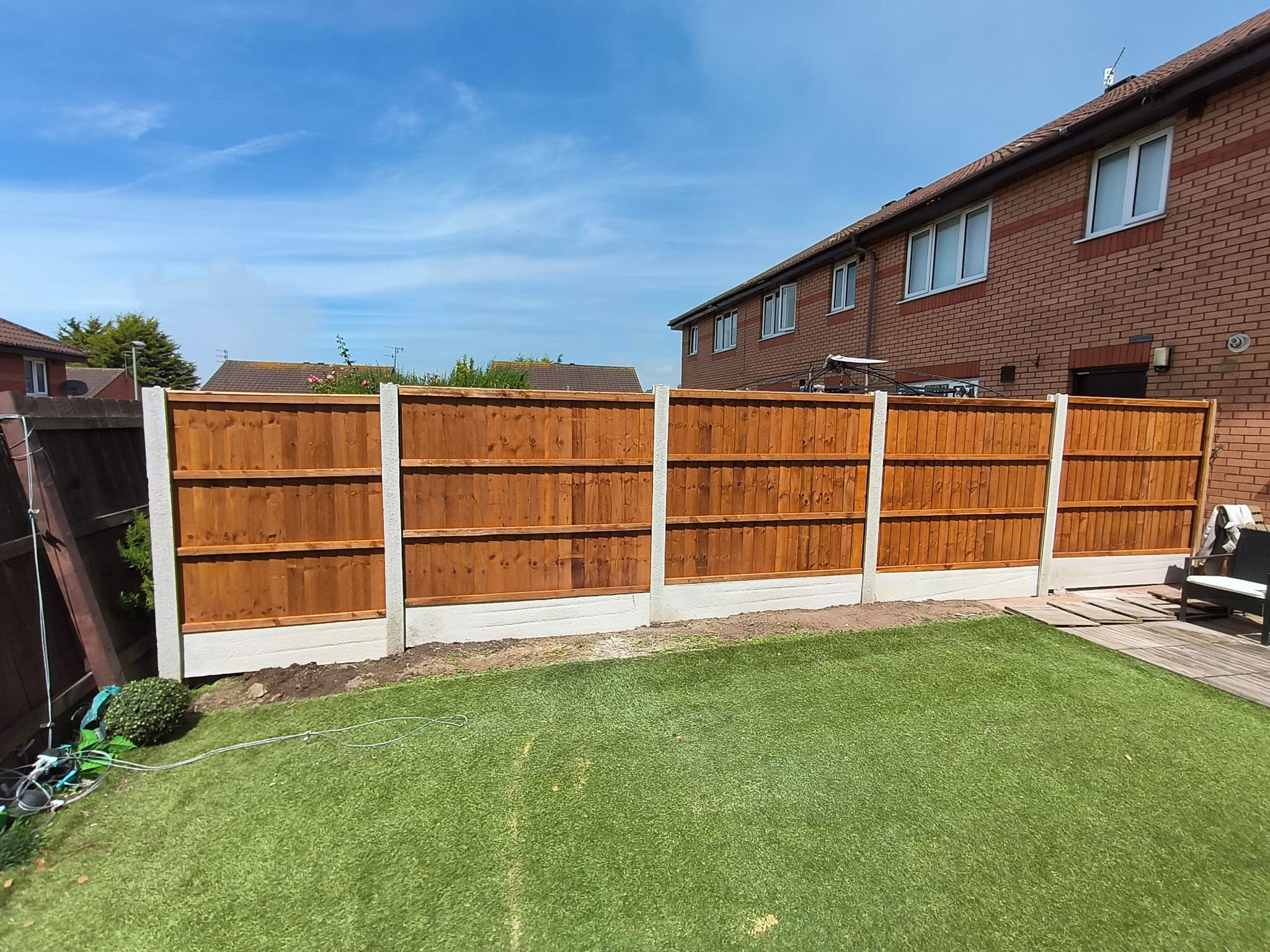 Boundary fencing installed along a street